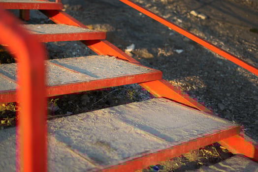 Beach stairs with red metal railing photo