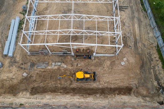 excavator on a construction site top view photo