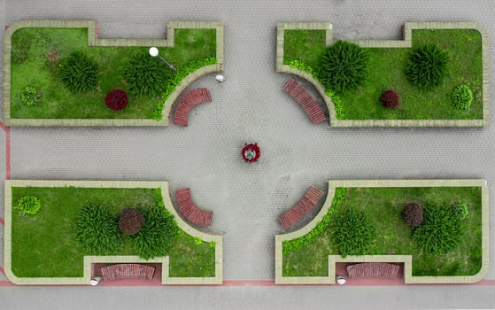 landscaped city street with benches top view photo