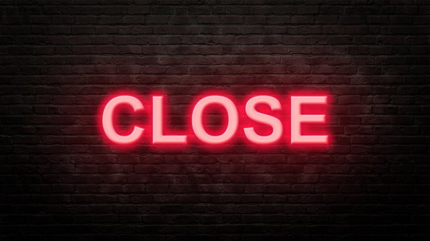 close neon sign emblem in neon style on brick wall background photo