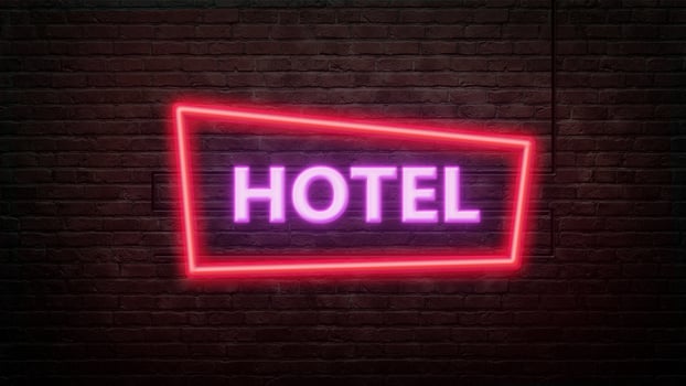 hotel sign emblem in neon style on brick wall background photo