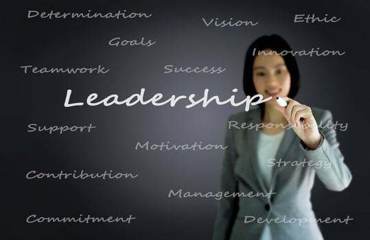 businesswoman with pen writing on the screen.Leadership photo