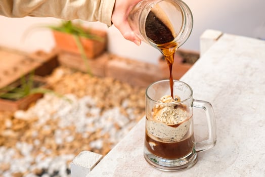 Affogato coffee with ice cream on a glass cup with garden background, Summer Cocktail photo
