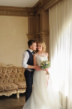 Groom puts a wedding ring on his bride. photo