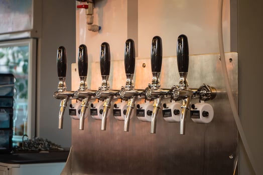 The craft beer taps at restaurant. Alcohol beverage ready to party. photo