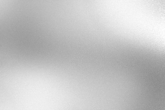 Glowing silver foil metal wall surface, abstract texture background photo