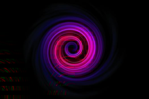 Abstract purple red spiral smoke with blue fog on black sky background photo