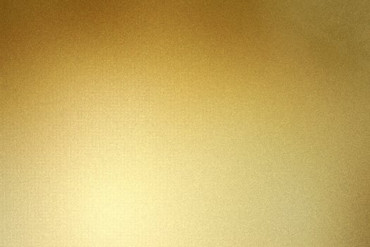 Shiny gold foil glitter metal sheet wall with rough surface, abstract texture background photo