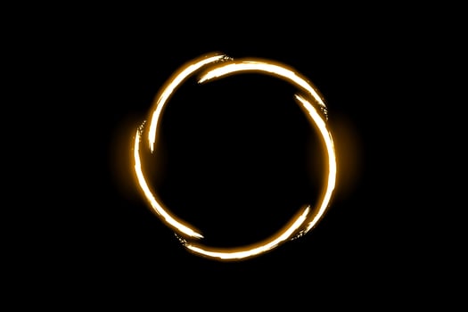 Abstract gold vortex. Shining lights in motion with particles on black background photo