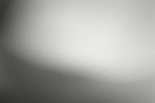 Glowing black silver foil metal wall with copy space, abstract texture background photo