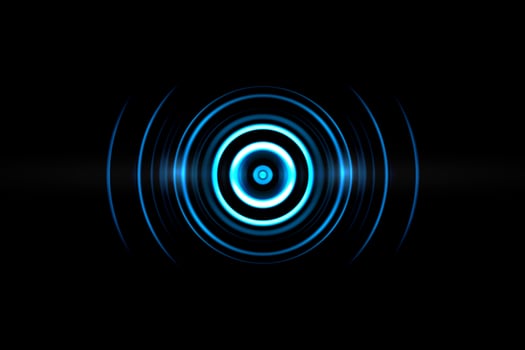 Abstract neon light blue circle effect with sound waves oscillating on black background photo