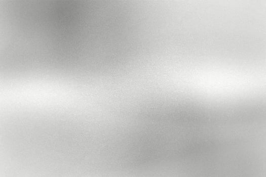 Glowing gray silver foil metal wall with copy space, abstract texture background photo