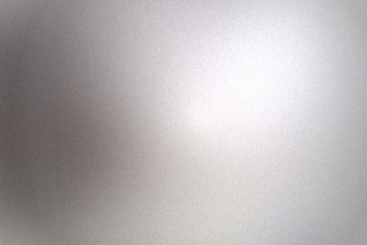 Light shining on gray silver foil glitter metallic wall with copy space, abstract texture background photo