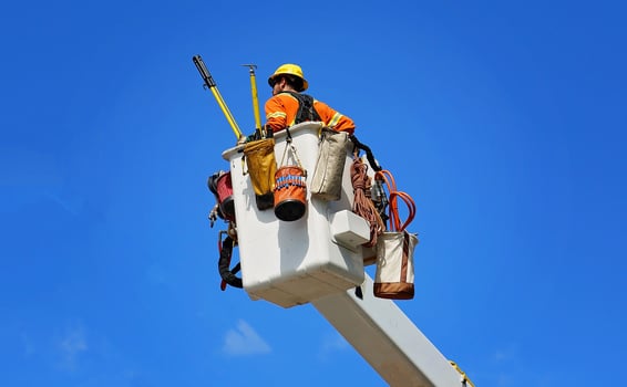 Electrician fixing electric lines photo