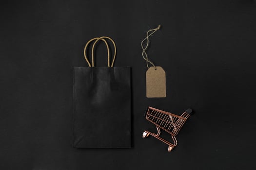Flat lay composition of shopping accessories for shopaholic online shopping and black friday sale promotion photo