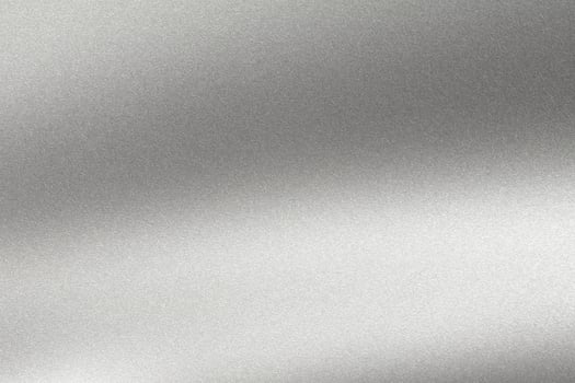 Abstract texture background, light shining on rough silver metal wall photo