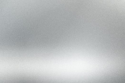 Abstract texture background, light shining on rough silver metallic wall photo