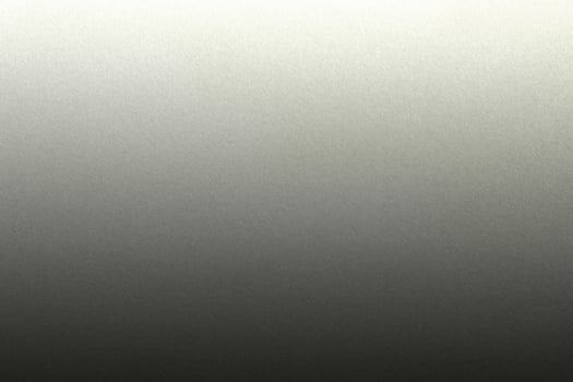 Light shining on rough black paint steel wall texture, abstract background photo