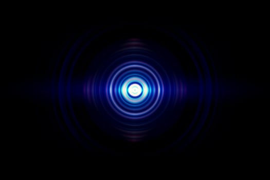 Abstract glowing circle blue light effect on black background photo