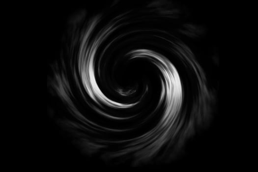 Abstract spiral fog on black background photo
