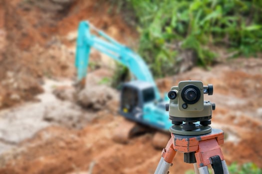 Surveyor equipment theodolite at construction site photo