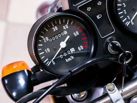 speedometer motorcycle with zero mileage. The bike is in the shop photo