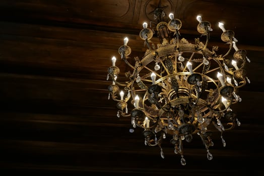 old luxury gold chandelier on the ceiling photo