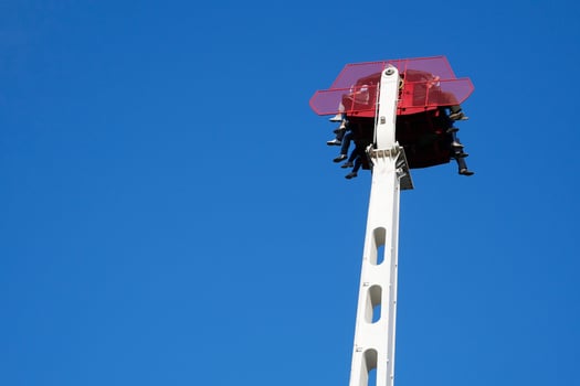People enjoying ride on free fall attraction in  lunapark photo