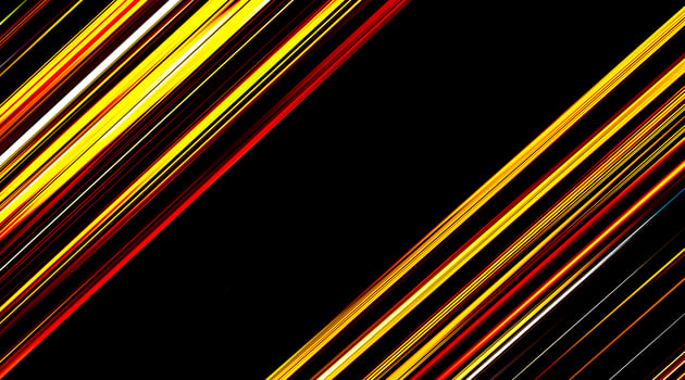 Colorful bursts of light on a black background. Colorful gradient twist space light flares, seamless loop. Movement. Diagonal yellow, red and white streaks of slowly flowing and changing light. photo