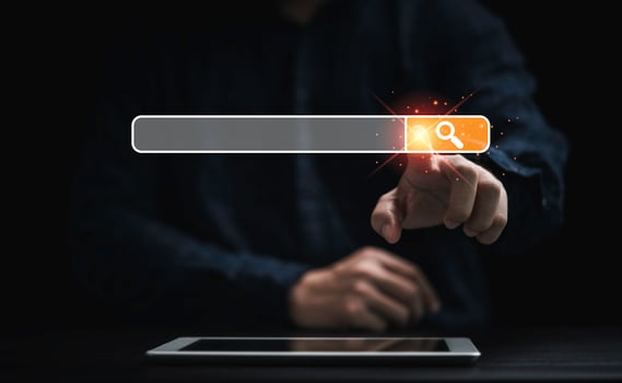Businessman using tablet and touching to search engine bar for Searching information network concept. photo