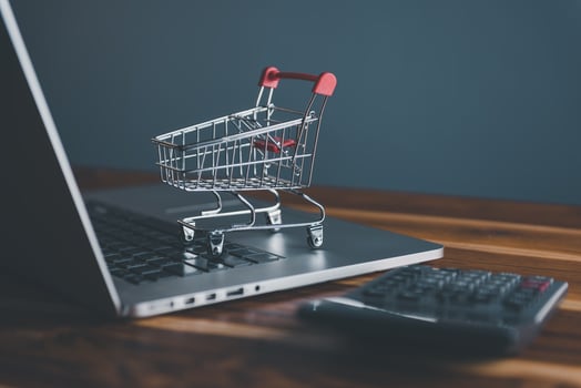 Mini Shopping Cart on Computer Laptop for Market E-Commerce Advertisement Concepts. Market E-commerce, Online Shopping Concept, Business Marketing Ecommerce Via Online Network. photo