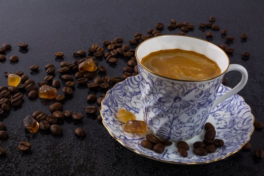 Porclean cup of coffee and brown sugar photo