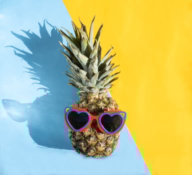 Pineapple hipster in sunglasses. Minimal concept, summer tropical pineapple. photo