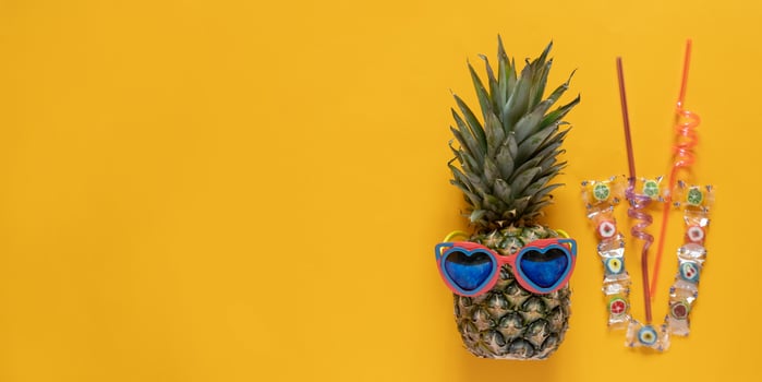 A smart pineapple in sun glasses with cocktail tubes Minimal concept, summer tropical pineapple.Summer, vacation, party photo