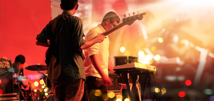 Guitarist and band on stage for blackground. Guitar player, soft and blur concept. photo