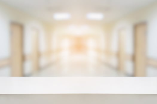 table counter with hospital interior corridor background photo