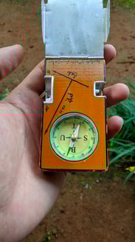 Compass to determine the Qibla direction of Indonesian Muslim graves.  The text in the photo means, Qibla and grave