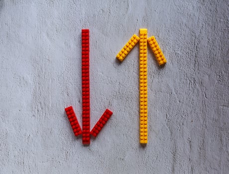 Arrow design from toy puzzle on white background. photo