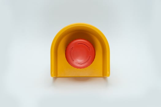 Stop Red Button and the Hand of Worker About to Press it. emergency stop button. Big Red emergency button or stop button for manual pressing. photo