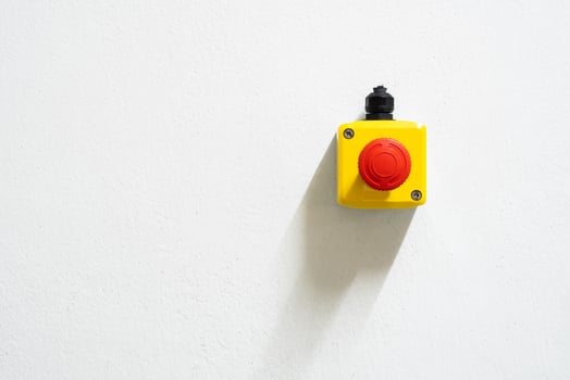Stop Red Button and the Hand of Worker About to Press it. emergency stop button. Big Red emergency button or stop button for manual pressing. photo