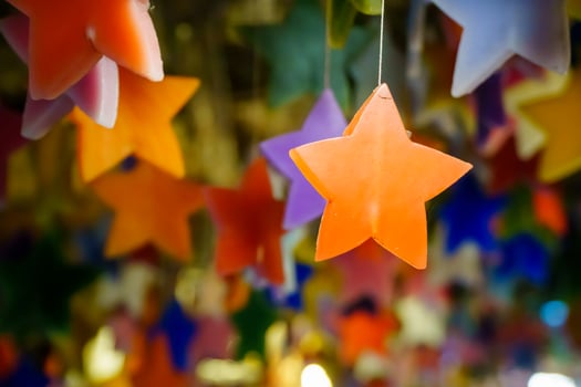 Multicolored candles cast in the shape of a star. photo