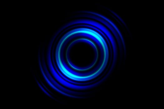 Abstract blue vortex, circle spin on black background photo