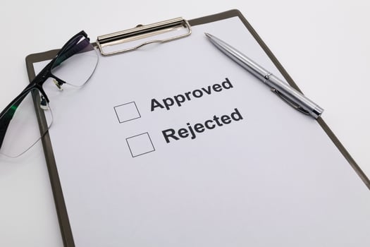 pen over document, select Approved or Rejected. photo