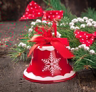 Christmas decorations and fir branches on the old wooden background photo