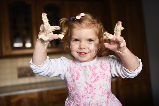 little girl kneading dough photo