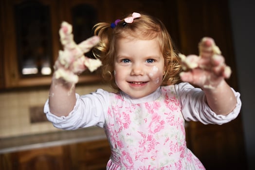 little girl kneading dough photo