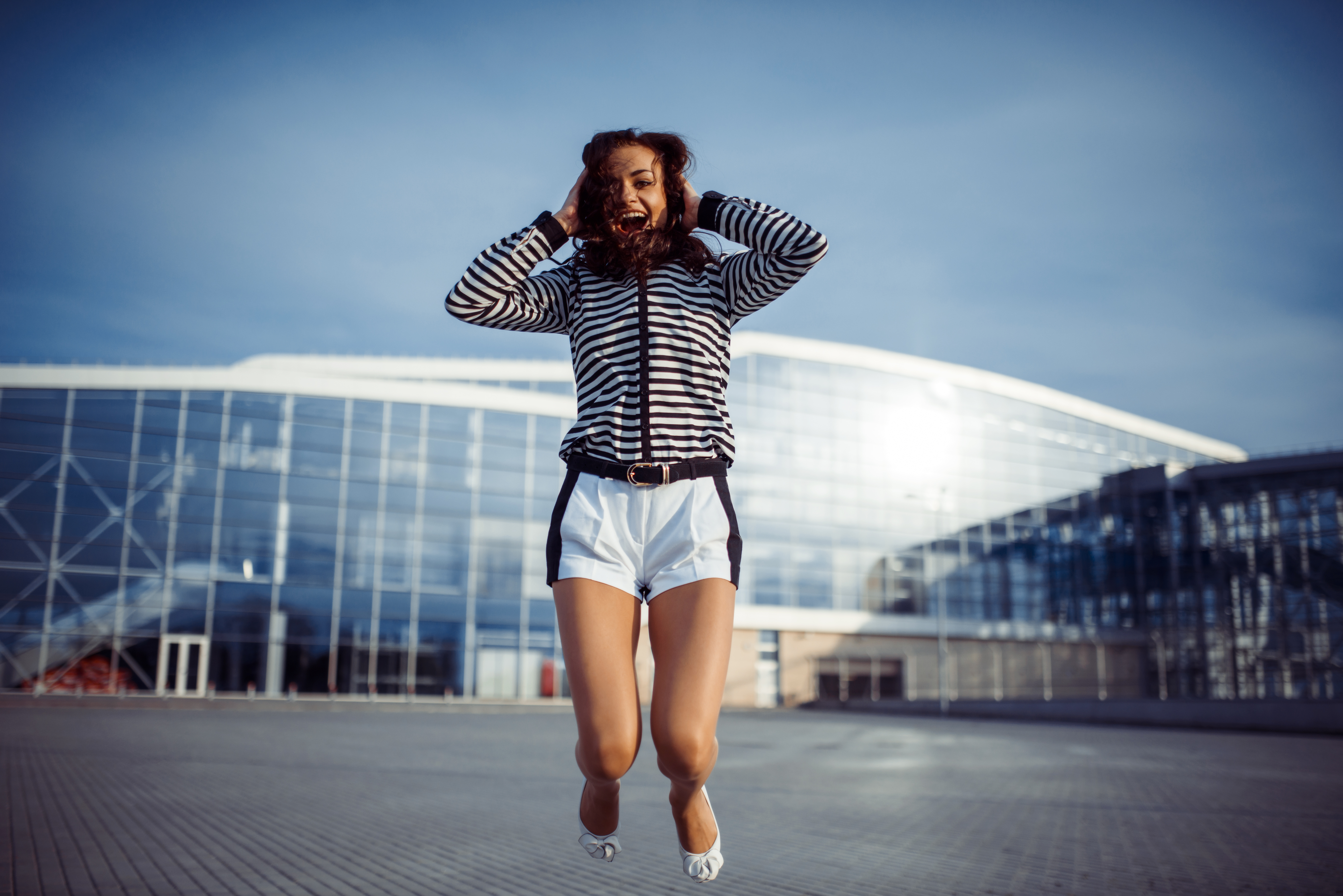 young carefree woman jumping photo
