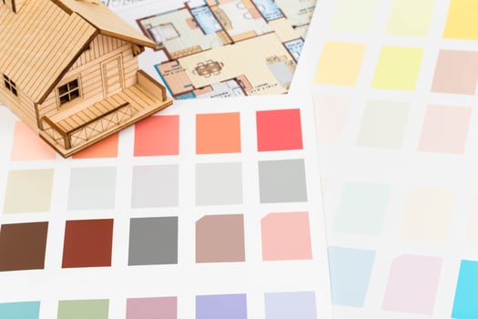 Paint color sample catalog with drawing, and house model photo