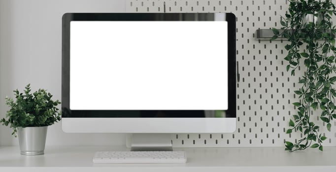 Mockup blank screen laptop on desk. Workspace with laptop and office supplies. photo