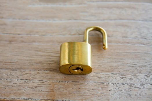 Golden padlock on wood background photo